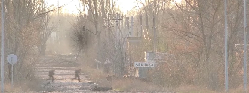 Fighters dash across Yasinovatskiy Pereyulok, the road that runs straight through the no-man’s-land between the Ukrainian Army and the pro-Russian separatists.