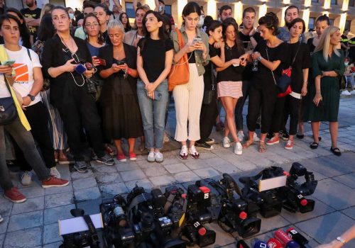Members of media attend a rally in memory of Pirveli TV channel cameraman Alexander Lashkarava, a victim of violence against LGBT+ activists and journalists last Monday, in front of the Office of the Georgian Government in Tbilisi, Georgia July 11, 2021. (Source: Reuters/Irakli Gedenidze)