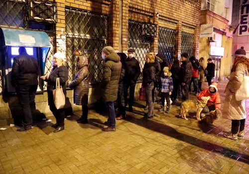 Residents of Donetsk line up at an ATM machine after receiving evacuation orders on February 18, 2022.