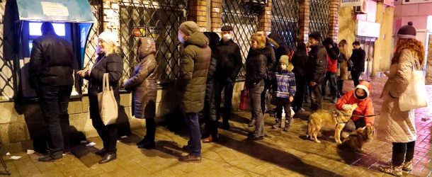 Residents of Donetsk line up at an ATM machine after receiving evacuation orders on February 18, 2022.