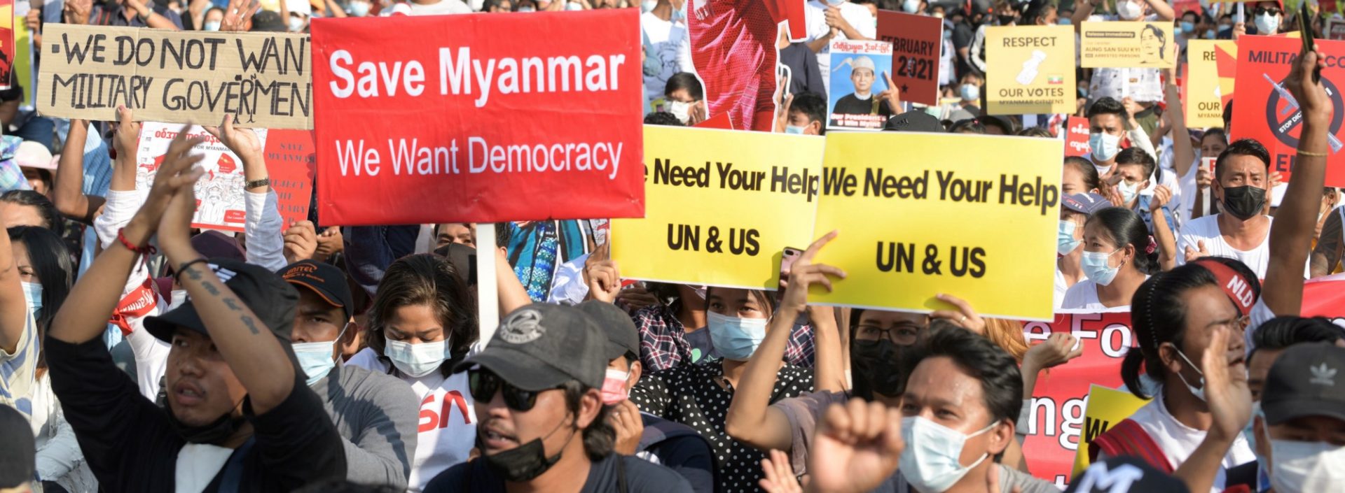 Demonstrators hold placards during a protest against the military coup in Yangon, Myanmar, February 15, 2021.