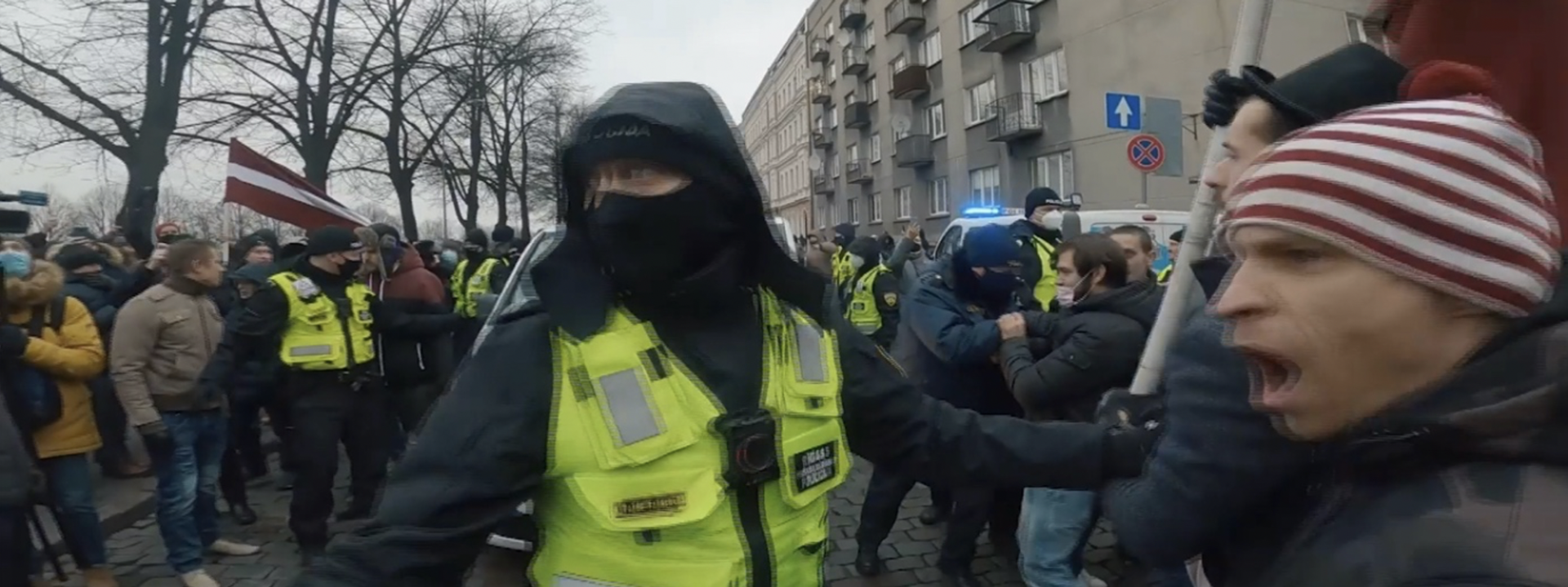 Protesters argue with police during the protest on December 12, 2020 in Riga.