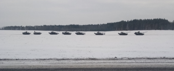 Screencap of video showing Russian armor in a field near Rechitsa.