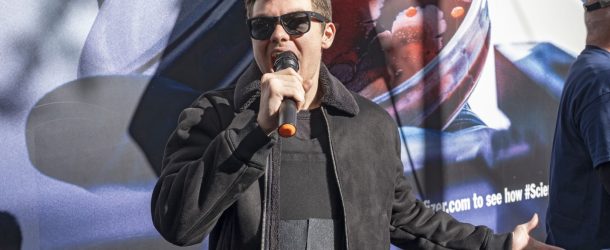 BANNER: Nicholas Fuentes of far-right group America First speaks at an anti-vaccine protest in front of Pfizer world headquarters in New York, November 13, 2021. (Source: Reuters/Ron Adar /SOPA Images/Sipa USA)