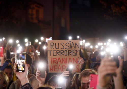 Protesters hold up their phones with flashlights lit during a protest in Warsaw, Poland on 17 October, 2022. Several hundred people gathered in front of the Iranian embassy to protest the supply of loitering Shahed drones to Russia. Russia is using the Iranian manufactured drones to attack Ukraine. Several dozen people have already died and critical infrastructure damaged in major cities after use of the Shahed drones by Russia. (Photo by Jaap Arriens / Sipa USA) (Photo by STR/NurPhoto)NO USE FRANCE