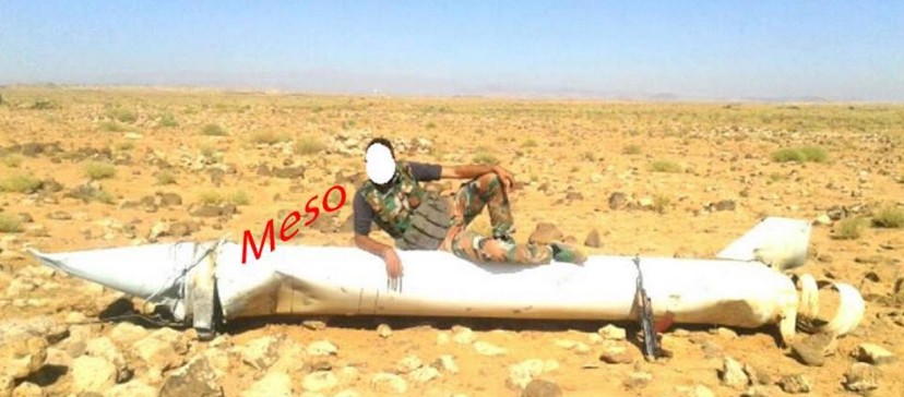 BANNER: Photograph of a man on what appears to be the rocket booster of an S200 missile.