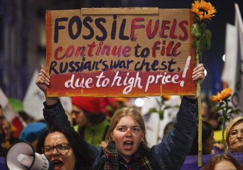 Protesters hold up signs as they take part in the 'Crisis Strike', a demonstration against the passivity of the Polish government in the face of the challenges related to the war in neighbouring Ukraine, the energy crisis and the climate crisis in Warsaw, Poland on 28 October, 2022. Several hundred people including members of the Agro Unia farmer's union and Greenpeace marched throuhg the city center. (Photo by Jaap Arriens / Sipa USA)No Use Germany.