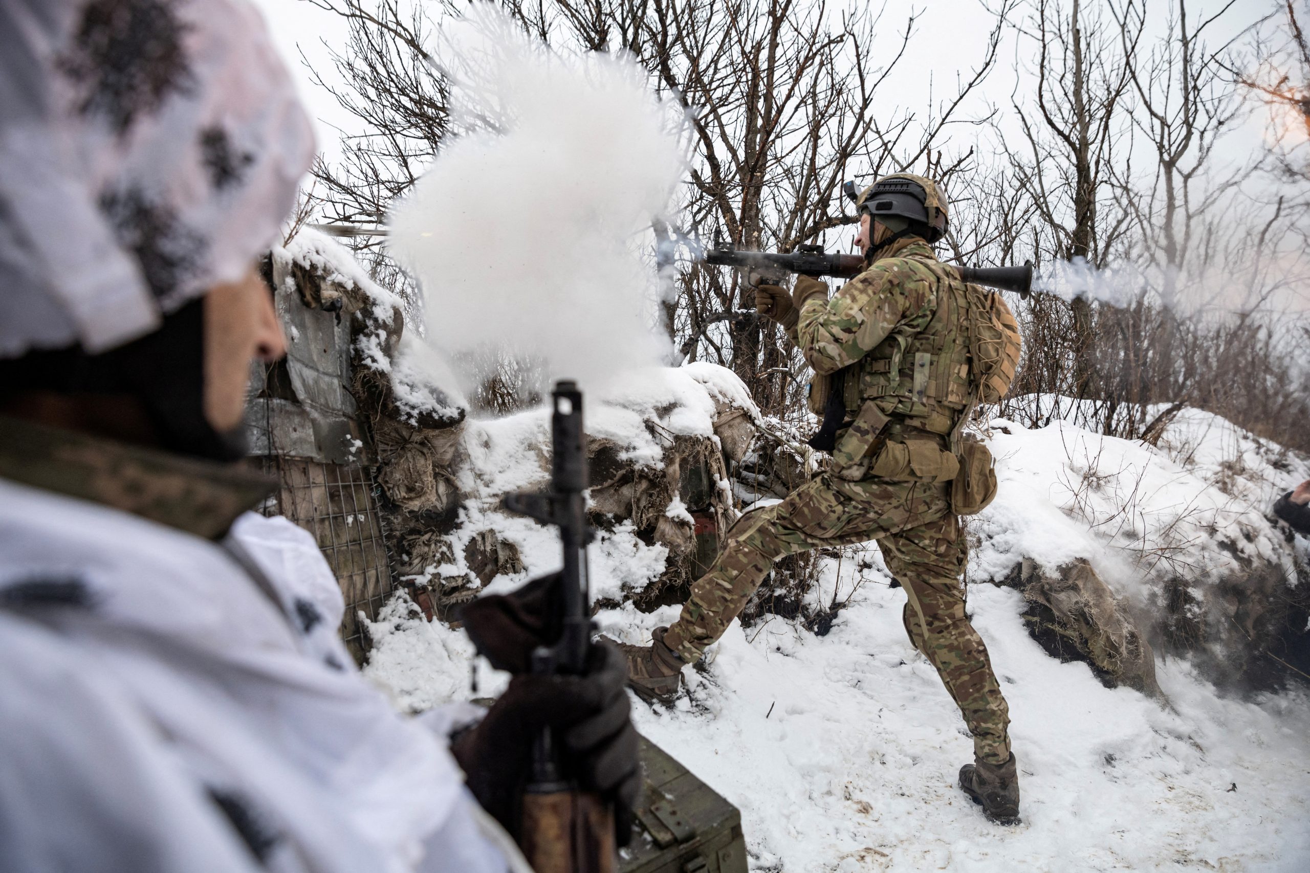 Bohdan, 'Fritz', the unit commander's deputy in the 79th Air Assault Brigade, fires a rocket-propelled grenade (RPG) towards Russian positions on a front line near the town of Marinka, in the middle of the Russia attack on Ukraine, Donetsk region, Ukraine, February 14, 2023. REUTERS/Marko Djurica