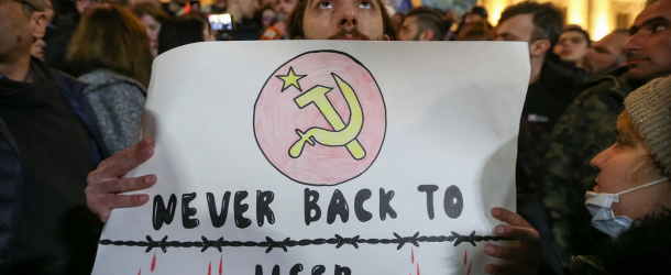 Participants protest against a draft law on “foreign agents” during a rally outside the parliament building in Tbilisi, Georgia, March 8, 2023. (Source: Reuters/Irakli Gedenidze)