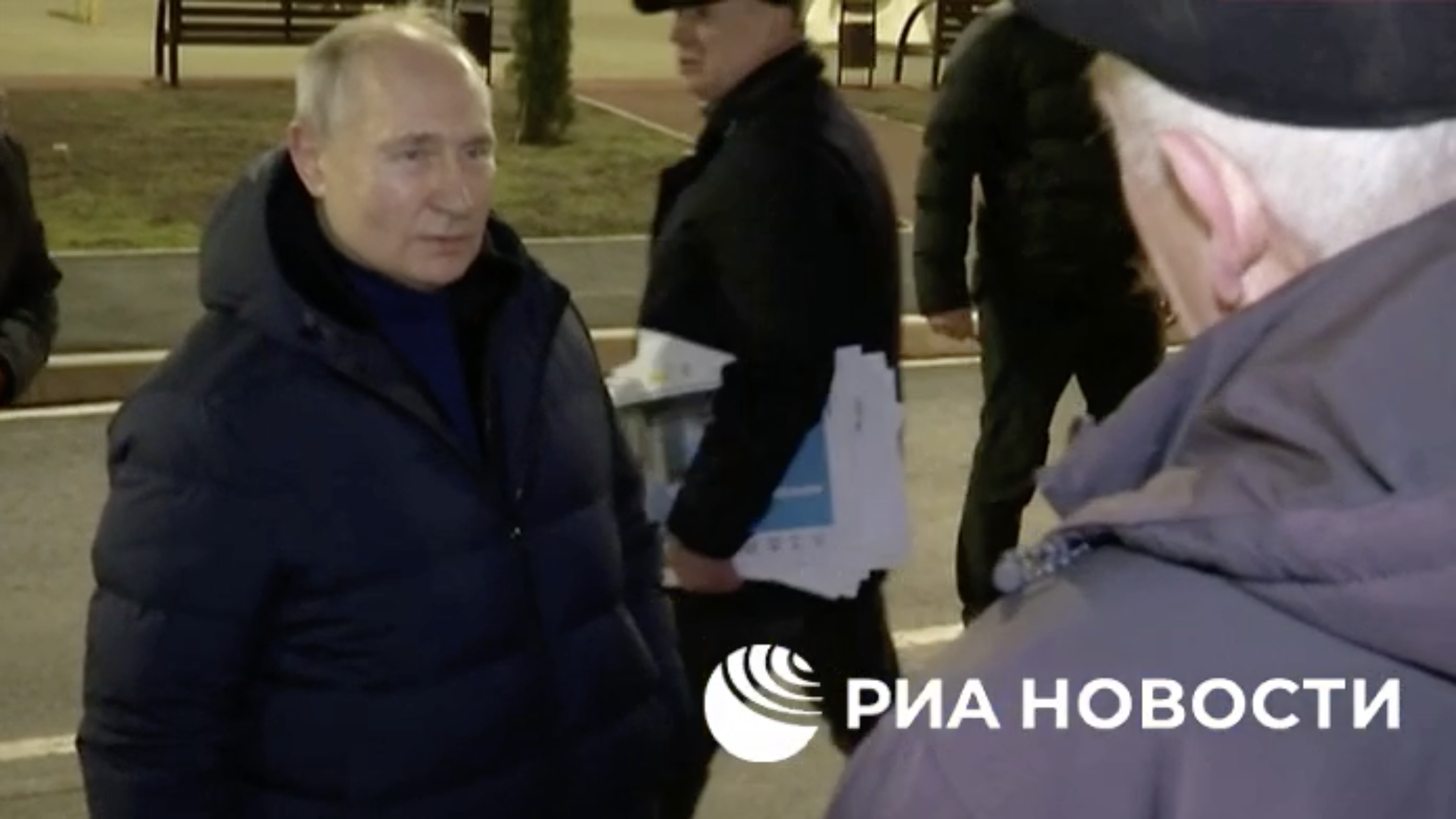 Footage published by RIA Novosti shows Vladmir Putin’s entourage reacting after a woman reportedly yelled “This all is not true! It’s all for a show!” The clip was later edited out by the Kremlin.