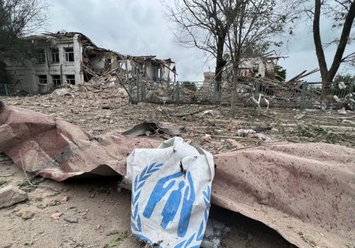 Banner: A damaged canvas sign featuring the logo for the United Nations High Commissioner for Refugees (UNCHR) appears among the ruins of an attack on an aid station in Zaporizhzhia Oblast, Ukraine. (Source: zoda_gov_ua/archive)