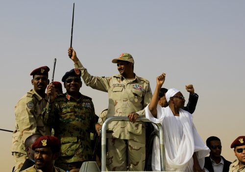 Lieutenant General Mohamed Hamdan Dagalo, deputy head of the military council and head of paramilitary Rapid Support Forces (RSF), greets his supporters as he arrives at a meeting in Aprag village, 60 kilometers away from Khartoum, Sudan, June 22, 2019. (Source: REUTERS/Umit Bektas/File Photo)