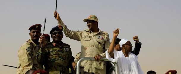 Lieutenant General Mohamed Hamdan Dagalo, deputy head of the military council and head of paramilitary Rapid Support Forces (RSF), greets his supporters as he arrives at a meeting in Aprag village, 60 kilometers away from Khartoum, Sudan, June 22, 2019. (Source: REUTERS/Umit Bektas/File Photo)