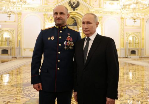 Russia's President Vladimir Putin and Commander of the Sparta Battalion Artyom Zhoga pose for a picture after a ceremony to present Gold Star medals to service members, bearing the title of Hero of Russia and involved in the country's military campaign in Ukraine, on the eve of Heroes of the Fatherland Day in Moscow, Russia, December 8, 2023. Sputnik/Mikhail Klimentyev/Kremlin via REUTERS