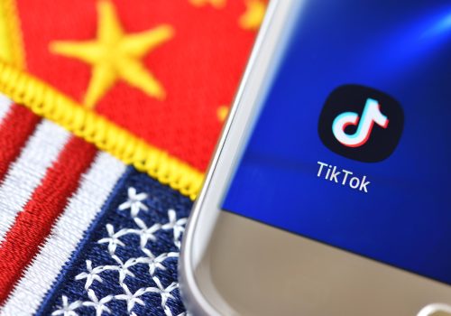 Smartphone with the app from TikTok on the flags of the USA and China. (Source: Reuters)