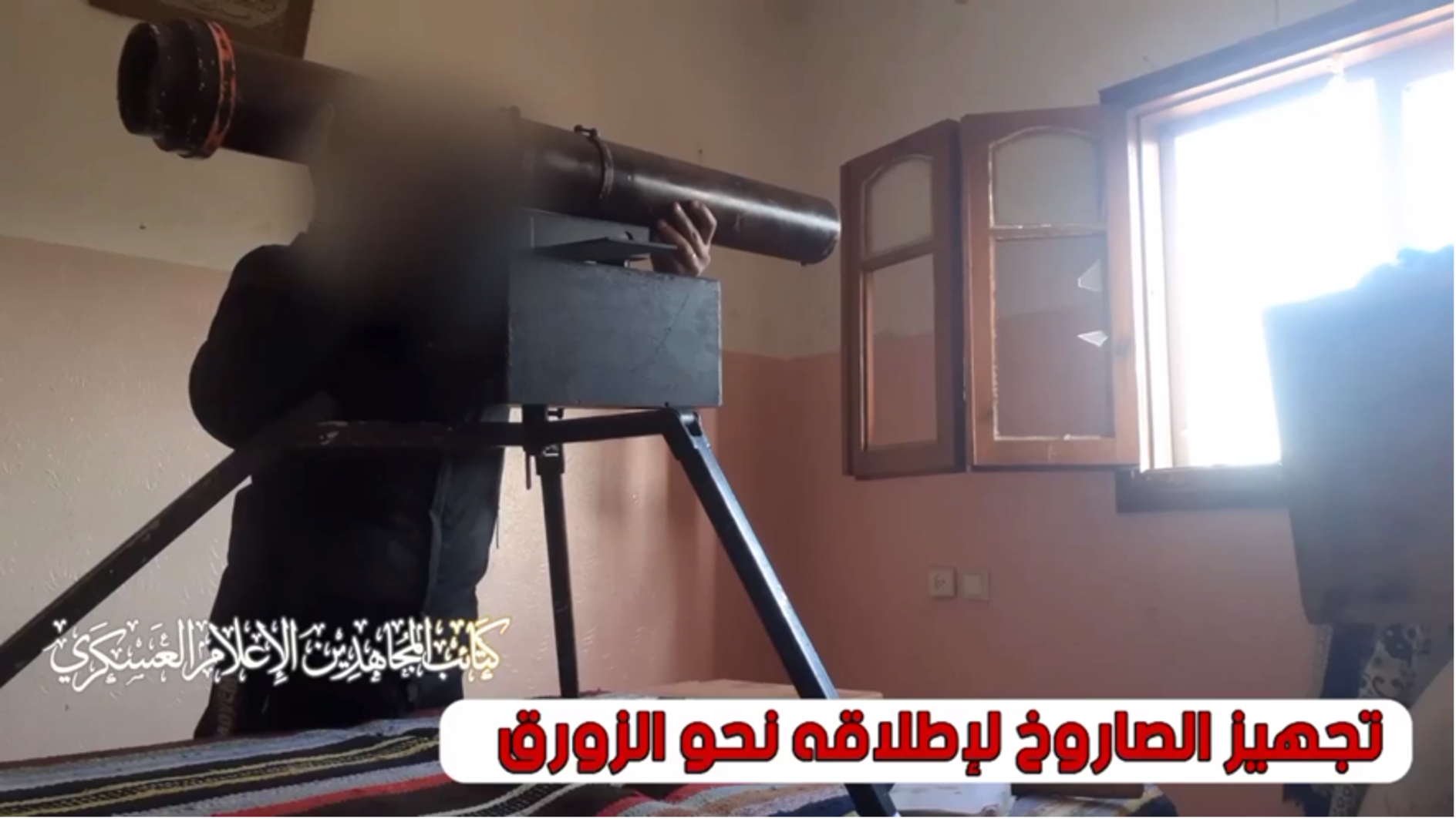 MB video still showing a fighter aiming a Sa’ir rocket at an IDF naval vessel. (Source: Telegram)