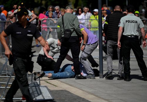 A person is detained after Slovakia's Prime Minister Robert Fico was shot at close range in an assassination attempt, after a government meeting in Handlova, Slovakia, May 15, 2024. Source: REUTERS/Radovan Stoklasa/File Photo)